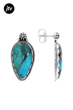 Indulge in the mesmerizing beauty of these exquisite Southwest Style by JTV ���earrings! Each earring features a captivating 25x13mm Blue Copper Composite Turquoise gemstone, carefully crafted to showcase its stunning natural hues. The composite turquoise pieces bound together create a unique and eye-catching design that is sure to turn heads.  Crafted with precision, these sterling silver earrings boast impeccable detail and quality. The intricate bezel setting enhances the allure of the pear-s Southwestern Oval Earrings For Gift, Southwestern Oval Earrings As Gift, Turquoise Sterling Silver Earrings - Fine Jewelry, Turquoise Sterling Silver Earrings Fine Jewelry, Turquoise Sterling Silver Fine Jewelry Earrings, Southwestern Blue Earrings With Natural Stones, Blue Southwestern Earrings With Natural Stones, Artisan Turquoise Gemstone Earrings, Fine Jewelry Turquoise Oval Earrings