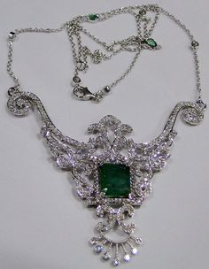 "18 K solid white gold Emerald and Diamond set necklace. Beautiful one of a type collection piece in very good condition. Total weight-23.020 grams, Diamond weight approx-3.80 cts, Emerald Weight-4.55 cts , length-54 cm( 21.25\") We can adjust length, size of pendant-7.5/6.5 cm , Material -18 K solid white gold , Natural Emerald and Diamonds. will supply with certificate." Silver Luxury Emerald Necklace With Brilliant Cut, White Gold Diamond Emerald Necklace With Hallmark, Luxury Silver Emerald Necklace For Formal Occasions, Silver Emerald Necklace For Formal Occasions, Exquisite White Gold Emerald Necklace With Diamond Cut, Formal Silver Emerald Necklace In Fine Jewelry Style, Formal Emerald Pendant Necklace With Diamond Cut, Classic Silver Emerald Necklace With Diamonds, Luxury Silver Emerald Necklace For Anniversary