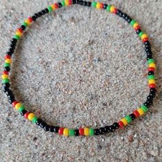 Rasta Seed Bead Stretch Anklet. Rasta Ankle Bracelet Jamaican | Etsy Beaded Bracelet Aesthetic, Bracelet Patterns For Beginners, Beaded Bracelets Ideas, Jamaican Colors, Pulseras Kandi, Diy Kandi Bracelets, Beaded Necklace Designs, Beaded Bracelets Tutorial, Belly Jewelry