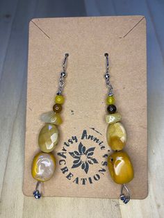 These earrings are unique and hand crafted. Made with jasper and citrine to boost your inner strength and to bring you clarity and abundance. Treat yourself or a loved one with this pair of handmade earrings and I guarantee your day will brighten.  D E T A I L S   *The earring hooks are made of silver  (nickel free)  *It takes about 1-2 business days to for each item to be mailed out  *Please contact me (the seller) with any questions  *returns/exchanges are available up until 7 days after your Unique Dangle Earrings With Gemstone Beads, Adjustable Earthy Beaded Earrings As Gift, Unique Natural Stones Beaded Earrings For Gift, Earthy Style Drop Earrings For Gift, Amber Natural Stones Earrings For Jewelry Making, Earthy Drop Earrings For Gift, Artisan Natural Stone Beaded Earrings As Gift, Earthy Beaded Dangle Earrings As Gift, Adjustable Drop Earrings With Gemstone Beads