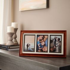 three pictures in a wooden frame on top of a table next to a candle and some books