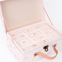 an open pink box with numbers and stars on it