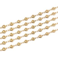 a set of five gold chain necklaces with hearts on each side and an open heart at the end