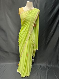 Elevate your style with our Party Wear Saree D-230! Adorned with exquisite pearl work, this saree will add a touch of elegance to any special occasion. Stand out in a crowd and feel confident in this stunning piece. Make a statement, get your Party Wear Saree D-230 today! Elegant Sharara With Mirror Work In Slub Silk, Elegant Slub Silk Sharara With Mirror Work, Bollywood Style Slub Silk Saree For Reception, Elegant Resham Embroidered Slub Silk Pre-draped Saree, Navratri Party Slub Silk Sharara, Navratri Party Sharara In Slub Silk, Elegant Slub Silk Pre-draped Saree With Resham Embroidery, Elegant Designer Pre-draped Slub Silk Saree, Pista Green Pre-draped Saree With Mirror Work For Navratri