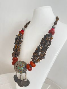 This necklace is a perfect gift for someone who truly loves and appreciates beautiful gemstones. I can only say that it is a beautiful piece of jewelry that will really make you stand out from the crowd. This necklace is made of huge beads. * Antique Moroccan Berber Necklace Handmade with coins, the necklace features an intricate pattern in its texture, a beautiful Berber piece of jewelry that radiates Moroccan Berber history and cultural significance, each handcrafted by artisans qualified from Bohemian Necklace With Polished Round Beads, Bohemian Beaded Necklace With Polished Round Beads, Bohemian Round Beaded Necklace With Polished Beads, Bohemian Polished Round Beaded Necklace, Bohemian Necklace With Polished Round Pendant Beads, Unique Festival Necklaces With Round Pendant, Handmade Necklaces For Rituals And Festivals, Bohemian Necklaces With Natural Stones, Bohemian Jewelry With Stones For Festivals