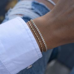 "Super cute beaded bracelet is great for layering or worn on its own! Delicate & chic makes it a great accessory! - - - D E T A I L S - - -  * Made of 925 Sterling Silver * THICK plating of 14k Gold or Rhodium  * Available in 6.25\", 6.75\" or 7\" + .5\" Ext Chain lengths * 2mm Rice Beads * Nickel-free & Hypoallergenic  * Lobster clasp closure with extension chain  Bracelets on Model: TENNIS BRACELET --> https://www.etsy.com/listing/899893520/tennis-bracelet-gold-tennis-bracelet? click_key=7b87b1a3c5a7ba74e2318e00058ba68f4b95e9ad%3A899893520&click_sum=5ad98715&ga_search_query=tennis%2Bbracelet&ref=shop_items_search_3&pro=1&sts=1 Pavé Bar Bracelet --> https://www.etsy.com/listing/1209136756/pave-bar-bracelet-dainty-bracelet-gold?click_key=54e2ad22904bdc08edfe0184adc9945aa6ba31d7%3A120913675 Rice Bead Bracelet, Dainty Gold Bracelet, Bracelet Tennis, Bracelet Minimalist, Bar Bracelet, Gold Armband, Rice Bead, Bracelet Dainty, Dainty Bracelet