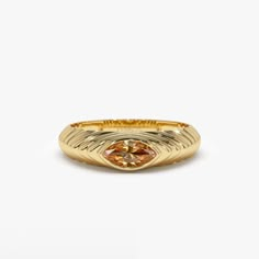 This 14k Gold step beveled ring features a radiant 7x3.5 MM marquise cut Citrine, the birthstone for November. The ring has a modern design, perfect for everyday wear, and the Citrine gemstone adds a pop of color to the piece. The step beveled design adds depth to the ring and the 14k Gold gives it a touch of luxury. This ring is perfect for anyone born in November or anyone who loves the color yellow. Features: * Made to Order * Gold Kt: 14K Solid Gold (also available in 18K) * Available Gold Colors: Rose Gold, Yellow Gold, White Gold * Marquise Citrine: 1 pc 7 x 3.5 MM * Citrine Carat Weight: 0.35 ctw * Ready to Ship in 7-10 Business days  ▶ See more of our Gemstone Jewelry here- https://etsy.me/3CGRdMI ▶ See our storefront here - http://etsy.me/2lUcVnH  ▶ All store sections here * Diamo November Birth Stone Rings, 2022 Rings, Beveled Ring, Citrine Rings, Men's Engagement Rings, Citrine Ring Engagement, Custom Signet Ring, November Birthstone Ring, Marquise Ring