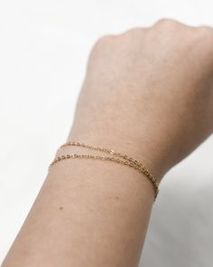 "𝗘𝗮𝘀𝘆 𝗧𝗼 𝗦𝘁𝘆𝗹𝗲, 𝗠𝗮𝗱𝗲 𝗧𝗼 𝗟𝗮𝘀𝘁 Our double wrapped chain is a classic and minimalist addition to your everyday bracelet stack! 𝗠𝗮𝘁𝗲𝗿𝗶𝗮𝗹𝘀 𝗪𝗲 𝗨𝘀𝗲 This bracelet is made entirely with sturdy 14k gold filled or sterling silver pieces. It is safe to wear in the shower, but we recommend avoiding prolonged exposure to chemicals like chlorine to keep your bracelet like new! 𝗟𝗲𝗻𝗴𝘁𝗵 𝗢𝗽𝘁𝗶𝗼𝗻𝘀    This bracelet is available in 5\", 6\", 7\", and 8\" sizes. Each comes with a 1\" extender chain. 𝗠𝗼𝗿𝗲 𝗗𝗲𝘁𝗮𝗶𝗹𝘀 -Chain measures 1.3mm -Spring ring clasp 𝗘𝘅𝘁𝗿𝗮𝘀 𝗮𝗻𝗱 𝗔𝗱𝗱 𝗢𝗻𝘀 Gift Box This gift box has a velour interior and features a sliding drawer style; it is a perfect place to keep your piece when it's not being worn! https://www.etsy.com/li Tarnish Resistant Chain Bracelet For Layering, 14k Gold Filled Satellite Chain Bracelet As Gift, Everyday 14k Gold Delicate Chain Bracelet, Minimalist Hypoallergenic 14k Gold-filled Bracelets, Minimalist Hypoallergenic 14k Gold Filled Bracelets, Minimalist Gold Bracelet For Layering, Everyday 14k Gold-filled Satellite Chain Bracelet, Everyday Double Chain Bracelet, Delicate 14k Gold Chain Bracelet For Everyday