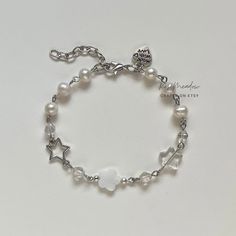 "Handmade Dreamy Pearl Bracelet ✿ Made with freshwater pearls, glass crystal beads,  glass beads, natural shell, and metal accents ✿ Colors: Silver, milky white, iridescent clear, and pearlescent white ✿ The bracelet has an additional 1-1.5\" of extension chain" Chain Bracelet With Beads, Diy Silver Bracelets, How To Make Chain Bracelets, Silver Pearl Charm Crystal Bracelet, Silver Crystal Bracelet With Pearl Charm, Handmade White Beaded Metal Bracelets, Handmade White Beaded Metal Bracelet, White Beaded Metal Bracelet, Handmade White Pearl Metal Bracelet