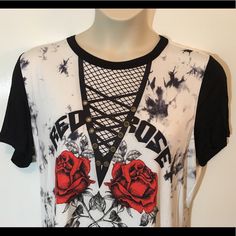 This Plus Size Short Sleeve Top Is The New Edgy Take On Your Boyfriend Cut Graphic T-Shirt, With Lace Up Illusion Neck Line, But Featuring A Crew Neckline. Runs Small Summer Short Sleeve T-shirt With Rose Print, Black Short Sleeve T-shirt With Rose Print, Black Rose Print Short Sleeve T-shirt, Summer Rose Print Short Sleeve T-shirt, Rebellious Black Crew Neck T-shirt, Rebellious Summer Crew Neck T-shirt, Black Crew Neck T-shirt With Rose Print, Rebellious Crew Neck T-shirt For Summer, White Rose Print Short Sleeve Top