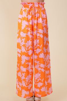 FEATURING LIGHTWEIGHT WOVEN FABRIC AND A WIDE-LEG DESIGN, THIS LOVELY TROPICAL PRINT PANTS OFFER A FLOWY FIT MEANT FOR FUN IN THE SUN. A MUST HAVE FOR YOUR SUMMER CLOSET! * ALL OVER LARGE SIZE TROPICAL PRINTS * LIGHTWEIGHT MATERIAL * SELF TIE DRAWSTRING WITH ELASTIC WAISTBAND * WIDE FIT * FULL LENGTH * THE MODEL IS 5'9" AND WEARING SIZE SMALL