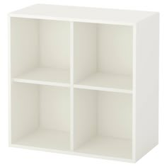 a white cube shelf unit with four sections