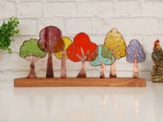 a group of wooden trees sitting on top of a table