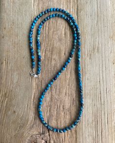 Blue Sea Sediment Jasper Bead Necklace https://kathybankston.com/products/blue-sea-sediment-jasper-bead-necklace-strand-small-4mm-blue-stone-beaded-necklace #jasper #necklace #summerfashion #beachy #beaded #handmade Adjustable Blue Turquoise Necklace With Gemstone Beads, Blue Turquoise Gemstone Beads Necklace For Spiritual Style, Spiritual Blue Turquoise Necklace With Gemstone Beads, Adjustable Blue Turquoise Necklace With Round Beads, Blue Turquoise Necklace For Healing, Hand-strung Blue Turquoise Necklace For Jewelry Making, Round Blue Turquoise Necklace For Healing, Blue Single Strand Necklace With Oval Beads, Blue Round Spiritual Beads