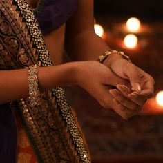 Description Crafted for festive events, this antique gold-plated silver bangle is expertly encrusted with Kempu stones on a traditional Indian temple & peacock ensemble. The perfect companion to festive attire the shine of the gold tone along with the Goddess Lakshmi motif makes it irresistible and regal. Style with a necklace set from the Mandira collection for a grand look. Product Information Metal: 925 Silver with 1.0 microns Antique Gold Plating Length: 6(2.6) cm Stones: Semi-precious stone Elegant Hand Set Traditional Wear For Diwali, Elegant Bangle For Navratri, Elegant Chandbalis For Ceremonial Navratri, Elegant Ceremonial Chandbalis For Navratri, Elegant Chandbalis For Navratri Ceremonies, Traditional Bracelets For Rituals, Bollywood Style Festive Traditional Wear With Intricate Design, Elegant Traditional Wear With Intricate Design For Navratri, Gold Peacock Design Bracelet For Festive Occasions