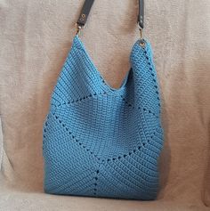 This is a high quality dark blue crocheted bag. The bag is completely made by hand. This fashionable bag will become an indispensable part of your wardrobe, suitable for any look and occasion. This wonderful handmade crocheted bag is the perfect accessory and a great gift for any holiday for your mother, sister, friend. Crochet gives the bag a soft, lightweight texture. Pleasant to the touch, a knitted bag is an excellent choice for any weather and any time of year. It has enough space to store your belongings and is not too small and not too big. To make knitted bags, we use both new and recycled materials of good quality, which allows us to respect the environment. Materials: cotton Cotton lining Lined pockets without fastening Height - 42 cm / 16,5 inch Width - 28 cm / 11 inch Detachabl Everyday Square Blue Hobo Bag, Everyday Blue Square Hobo Bag, Blue Knitted Shoulder Bag For Daily Use, Blue Knitted Shoulder Bag For Everyday, Blue Hand Knitted Rectangular Bag, Everyday Woven Blue Bags, Blue Bucket Bag With Braided Handles, Handwoven Blue Square Bag, Everyday Blue Woven Bag