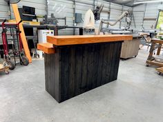 a workbench in a garage with lots of tools and woodworking equipment around it