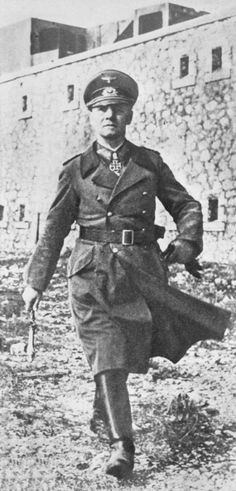 FIRST PUBLICATION IN THE EVENING PAPERS, FRIDAY, DECEMBER 31ST, 1943 Just received in London from a neutral source, this photograph shows Field-Marshal Rommel, wearing his Iron Cross and carrying his baton, inspecting German defences in the coastal area of Western Europe. Rommel has superseded von Rundstedt as invasion defence chief. (Photo by Planet News Archive/SSPL/Getty Images) Erwin Rommel, German Soldier, Desert Fox, Field Marshal, Military Ranks, Germany Ww2, 31 December, Ww2 Photos, Iron Cross