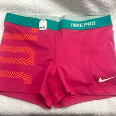 Nike Pro Workout Shorts Size Large New Without Tags Pink With Hot, Orange And Teal Accent The Tag Has Been Cut Out. I Do Not Know What The Shorts Are Made Out Of. 15 Inch Flat Waist Measurement. Dry Fit Never Worn Never Washed No Flaws Pink Go-dry Athletic Shorts For Gym, Pink Short Bottoms For Cheerleading, Pink Go-dry Gym Shorts, Pink Go-dry Shorts For Gym, Pink Go-dry Training Bottoms, Pink Go-dry Bottoms For Training, Pink Go-dry Shorts, Sporty Pink Cheerleading Bottoms, Sporty Pink Bottoms For Cheerleading