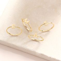 Here is Custom Initial Letter Ring 14K Gold for Girl. Dainty Personalize Word Stacking Ring will be perfect 10K Personalize Ring! This 10K 18K Gold Monogram Ring can be switched with her Letter and you can create Custom Initial Ring! This custom letter ring will be great Comfort Fitting Ring in her daily life! Are you looking for 18K dainty word ring, here's the perfect monogram ring for girl, women, best friends, girl, girlfriend, wife or for yourself. This custom initial ring and birthday ring will can be either Exciting custom letter ring with her initial or your letter. You can check our other personalized ring in here : https://www.etsy.com/shop/minifinejewels?ref=seller-platform-mcnav&section_id=36148465 Jewelry Details Carat:585 - 14K Solid Gold  There are 585 stamps in our rings. T Gold Stackable Rings With Initials, Stackable Yellow Gold Rings With Initials, Dainty Yellow Gold Rings With Initials, Dainty 14k Gold Name Rings, 14k Yellow Gold Custom Name Ring, 14k Yellow Gold Rings With Engraved Name, 14k Yellow Gold Rings With Name Detail, Gold Initial Ring With Hallmarks In 14k Gold, 14k Yellow Gold Initial Ring As A Gift