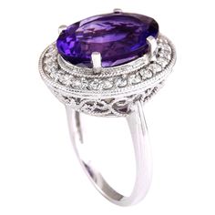 Stamped: 14K White Gold Total Ring Weight: 7.8 Grams Ring Length: N/ARing Width: N/A Gemstone Weight: Total Natural Amethyst Weight is 6.01 Carat (Measures: 14.90x11.05 mm) Color: Purple Diamond Weight: Total Natural Diamond Weight is 0.80 Carat Quantity: 24 Color: F-G, Clarity: VS2-SI1 Face Measures: 19.85x17.10 mm Sku: [703401W] Oval Purple Amethyst Ring With 17 Jewels, Elegant 14k White Gold Purple Ring, Luxury Purple Gemstones With Halo Setting, Elegant Purple 14k White Gold Ring, Oval Amethyst Ring In 14k Gold With Brilliant Cut, Purple 14k Gold Rings With Brilliant Cut, Purple 14k White Gold Wedding Ring, Purple 14k White Gold Rings For Wedding, Elegant Oval Purple Gemstones