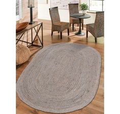 an oval rug in the middle of a room