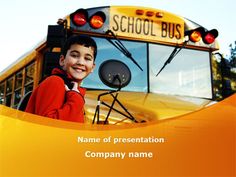 a young boy standing in front of a school bus