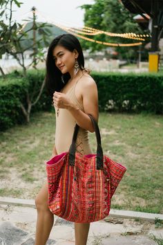 "The beautiful tote bag designed by oriental inspiration for lazy days at the beach and wandering around. It is made with an amazing piece of fabric woven by the HMONG hill tribes of Lanna Region (Northern Thailand). It features cotton lining, Leather Straps and a zipper closure. This bag will enhance your appearance. We buy materials from Hmong market and we design and sew by hand. Some of the bags we modify to improve the product. The Hmong tribes live in the North of Thailand and have origins Bohemian Rectangular Hobo Bag For Beach Season, Beach Embroidered Natural Shoulder Bag, Bohemian Shoulder Bag For Beach Travel, Bohemian Shoulder Bag For Beach Season Travel, Traditional Tote Beach Bag For Travel, Woven Festival Bags For Beach Season, Woven Bags For Beach Festival Season, Embroidered Tote Shoulder Bag For Beach, Embroidered Travel Bags For Beach Season