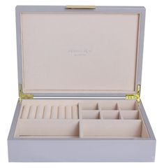 an open white box with compartments on the inside