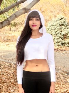 "This white long sleeve cropped hoodie has a soft feel and a stylish and edgy fit that is loose-fitting and comfortable. This boxy crop top is made from a soft fleece fabric.  Best paired with: Cutoff shorts, your favorite pair of jeans, a nice mini-skirt, or your favorite exercise wear and lounge wear. The model is 5'3\" and wearing a size small.  Keep in mind that this top, especially in small, is very short; order a size up if you want the top to be longer. Size Chart (inches):                              S                  M           L Bust                      26-31   32-35    35-38 Natural Waist      26            36    36 Length                      12             16     16  Materials:  30% cotton, 70% polyester. Custom print on this crop top: Yes. You can request your own design White Long Sleeve Cropped Sporty Sweater, White Cropped Sweatshirt For Winter, Winter Cotton Stretch Crop Top, Winter Stretch Cotton Crop Top, Spring Cropped Hoodie With Stretch, Stretch Cropped Hoodie For Spring, Casual Cropped Stretch Hoodie, Spring Cropped Stretch Hoodie, Casual Stretch Cropped Hoodie