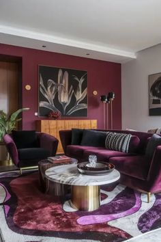 a living room with purple and black furniture