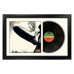 an old vinyl record in a black frame