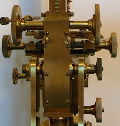 an old clock with several gears attached to it