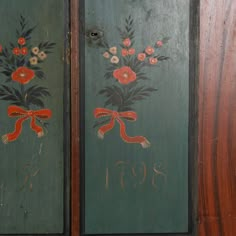 two painted doors with flowers and numbers on them