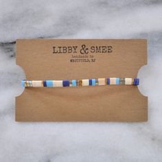 Like little works of art you can wear, these stretch tile bracelets — all in exclusive Libby & Smee patterns — are perfect on their own or in one of our curated sets. Stacking is strongly encouraged. style: SKY glass and gold-plated tile beads stretch cords finished with gold-plated crimp covers lead-free and nickel-free comes in one 7" size to fit most wrists packaged in a clear resealing bag for storage and gift giving SAVE $15 when you buy a curated set or pick any three here: Libby & Trendy Rectangular Beaded Bracelets As Gift, Trendy Rectangular Beaded Bracelets For Gifts, Adjustable Blue Rectangular Bracelets, Tile Bracelet, Works Of Art, Gift Giving, Bracelet Set, Color Blocking, Lotion