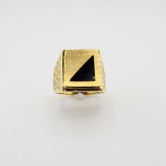 Inventory #:  GROx-001270A Stunning Heavy Vintage New 18K Yellow Gold Rectangular Black Onyx Ring/ Triangle Onyx Shape/ Signet Ring Area/ Art Deco Style/ Size 11 ½ / 13.66 Grams This is a truly unique ring that can be engraved with initials opposite the onyx. This is a New- Never worn ring from a 1989 jewelry store close out. The 2nd picture is taken on macro for more detail Size: 11 1/2 Metal:  18K Yellow Gold Weight: 13.663 grams.  There are 31.1 grams to an ounce, for reference.   Dimensions:  The ring is 11/16" wide x 5/8" across x 5.46mm thick and tapers in back to 4.26mm wide.   The dime is 1.3mm thick, for reference. Stones:  Black onyx.  Triangle area is 12.95mm x 9.41mm x 9.13mm.  The onyx is 3.8mm thick.   Maker:  Levian Arrives Gift Boxed We have a generous 30 day return policy Black Enamel Ring With Polished Finish For Formal Occasions, Formal Black Enamel Ring With Polished Finish, Gold Rectangular Modernist Signet Ring, Gold Ring With Rectangular Stone And Polished Finish, Modernist Gold Rectangular Signet Ring, Gold Rings With Polished Finish And Rectangular Stone, Formal Yellow Gold Onyx Rings, Black 14k Gold Signet Ring With Gemstone, Formal Yellow Gold Rings With Black Enamel