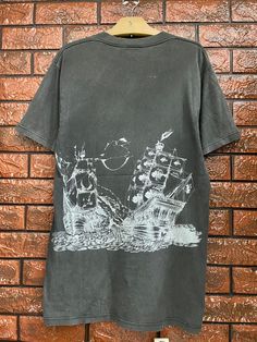 Vintage 80s OG Bronze Age Skateboard Old Skates T Shirt / Powell Peralta / Santa Cruz / Thrasher / 90s Streetwear Made In Usa Size M Condition : Heavy Used  Size on tag : L Colour : Faded Black Brand : Bronze Age Measurement : Armpit to armpit - 19" Length - 31" Material : Old Cotton Made In: USA  THE SHIPPING (Your Choice Please read) 1. The shipping cost is USD 20 via Malaysian Registered Postage With Tracking Number. It will take 2-4 weeks or more for delivery, depends on your custom checking Vintage Printed Tops For Streetwear, Vintage Graphic Print Crew Top, Vintage Crew Neck Top With Graphic Print, Vintage Crew Neck Graphic Print Top, Skate Shirts, Dark Spirit, Powell Peralta, Skate T Shirts, 90s Streetwear