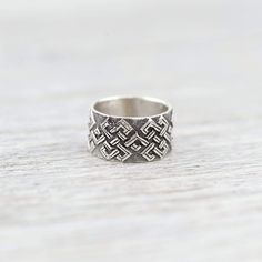 Solid sterling silver unisex Eternal Knot ring handmade by a fair-trade group of silversmiths in Nepal. This ring is extremely well crafted and has beautiful details. Featuring a hand carved and etched continuous Eternal Knot design, which is one of the 8 Auspicious Symbols. Sized ring - please be sure to choose your size! The Endless, or Eternal Knot has special meaning throughout many cultures and can serve as a reminder of interconnectedness and unity. It is one of the 8 Auspicious Symbols th