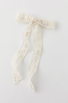 the white lace is tied up with a ribbon