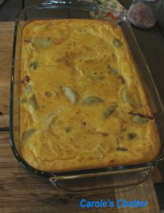 a casserole dish sitting on top of a wooden table