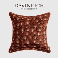 an orange and white pillow on a gray background with the words, davinrich home collection