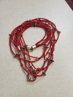 Chicos, Cardinal Red, 40 inch, 6 Strand Plastic Bead and Brass Bead, Layered Necklace, Costume Jewelry, Fashion Accessory This is a great find and a very large fashion statement. Very decorative and collectible. The measurement is taken from the top of the necklace to bottom strand. Check out our shop for monthly specials. We have a variety of items for every taste. Combine several of our items together to save on shipping. If you have any questions, please do not hesitate to ask. I will ship ou Red Bohemian Beaded Necklaces With Spacer Beads, Red Multi-strand Necklace With Wooden Beads, Multi-strand Red Necklace With Wooden Beads, Multi-strand Necklace With Red Wooden Beads, Red Multi-strand Beaded Necklace With Spacer Beads, Red Large Multi-strand Beads, Red Polished Bead Necklaces For Beach, Red Multi-strand Beaded Necklace, Red Beach Necklace With Spacer Beads