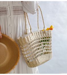 An artisanal basket of hand-woven straw basket bag. Perfect for this summer! Shoulder or top handle carry. Its light weight and durable construction make it ideal for carrying items for a day at the beach or a special event. Show off your style and make a statement with this unique tote bag. Size: 37cm wide opening x 25cm tall (14in x 10in) Designer Style ID: 8439 Eco-friendly Open Weave Straw Bag For Summer, Casual Braided Straw Bucket Bag, Casual Braided Bucket Bag For Vacation, Natural Open Weave Straw Bag For Vacation, Spring Braided Basket Shoulder Bag, Natural Open Weave Straw Bag For Beach, Summer Braided Rattan Bags, Basket Shoulder Bag With Open Weave For Beach, Natural Open Weave Straw Bag For Beach Season