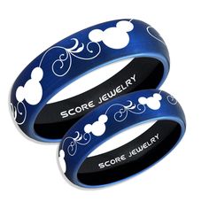 two blue mickey mouse rings with the words score jewelry on them, both in black and white