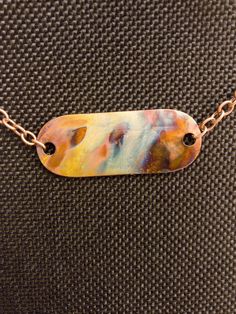 Fire-painted copper pendant with chain.  Each one is unique and actual necklace may look different than the photo. Artistic Multicolor Copper Jewelry, Artsy Hand Painted Copper Jewelry, Unique Multicolor Copper Necklace, Multicolor Copper Necklace, Artistic Copper Pendant Necklace, Fire Painting, Columbia Mo, Pendant With Chain, Copper Pendant