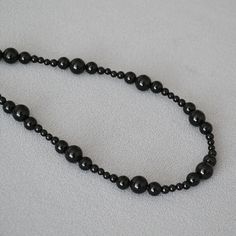 Material: Agate Fashion Element: Round Style: Niche Black Necklaces With Natural Stones, Black Long Necklace With Gemstone Beads, Black Agate Beads For Jewelry Making, Adjustable Black Agate Bead Jewelry, Adjustable Black Long Crystal Necklace, Black Agate Necklace With Black Beads, Handmade Black Agate Beaded Necklaces, Adjustable Black Agate Beaded Necklaces, Black Agate Bead Necklaces