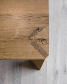 a close up view of a wooden table with wood grains on the top and bottom