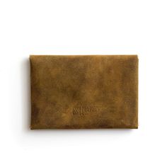 This handcrafted leather card holder is created to be flexible and stylish, keep your cards and cash safe, and to last. Low profile, clean and simple design, easily fits in your front pocket, or thrown into a purse or backpack, it really checks all the boxes. Cut from the same top-grain leather that our MacBook and iPad cases are made from and finished with a solid brass button stud. This unique no-stitch design is sleek, low profile, and just what you're looking for. Holds 10-15 cards or folded Rectangular Waxed Finish Card Holder Gift, Rectangular Wallets With Waxed Finish For Everyday Use, Vintage Rectangular Card Holder For Everyday Use, Everyday Trifold Wallet With Hidden Phone Sleeve, Vintage Card Holder With Interior Card Slots, Brown Rectangular Trifold Wallet With Waxed Finish, Everyday Trifold Wallet With Waxed Finish, Classic Waxed Trifold Wallet, Everyday Waxed Finish Trifold Wallet