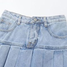 Elevate your style with our iconic 90s-inspired pleated miniature jean skirt from the 2023 Summer Collection. Perfect for sunny summer days and breezy summer nights. this mid-rise skirt features a light wash. a zipper & button closure. and pleats that will take your look to the next level.Why You'll Fall In LoveThis 90s-inspired mini skirt is the perfect blend of feminine charm and timeless style. With its mid-rise form and light wash. it's sure to add instant style to your wardrobe. The pleats. Retro Pleated Skirt Bottoms For Summer, Y2k Style Pleated Denim Skirt, Y2k Style High Rise Denim Skirt For Summer, Y2k High Rise Denim Skirt For Summer, 90s Style Summer Skirt With Pockets, Y2k Pleated Skirt Bottoms For Spring, 90s Style Skirt With Pockets For Summer, Trendy Light Wash Mini Skirt For Summer, Retro Pleated Mini Skirt For Summer