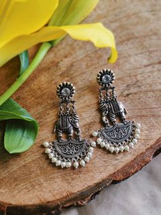 Stunning heavy look ethnic earrings  jhumka jhumki stud Afghani earrings in silver tone  With intricate carved work and sparkling ghunghroos which gives a traditional touch to the earrings  Perfect with ethnic and traditional wear  Can be a perfect gifting option for friends and dear ones  Silver metallic ghunghroo tinkle to create a striking look  With intricate carved word and sparkling ghunghroo which gives a traditional touch to the earring. Silver metallic base tinkle to create a striking l Cheap Metal Jhumkas For Festivals, Cheap Handmade Women's Jhumkas, Affordable Traditional Silver Earrings, Cheap Jhumkas For Navratri, Silver Oxidised Earrings, Vintage Indian Jewelry, Silver Jhumkas, Earrings Jhumka, Hand Jewelry Rings